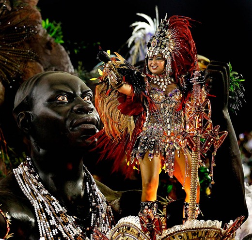 Performers from the Beija Flor samba school joi Carnival celebrations at the Sambadrome in Rio de Janeiro. (Silvia Izquierdo/Associated Press)